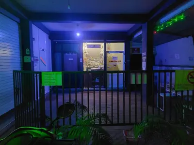 a room with a blue light on a building at Fathima Arcade Lodge