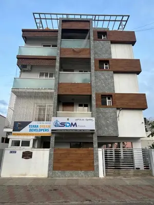 a building with a sign on the side of it at Falcon Heights in Mysore