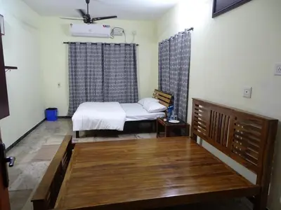 a bedroom with a bed in a room at Eden luxury stay saravanampatti in Coimbatore