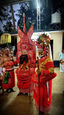 a couple of people standing next to a statue at Seawind in Kannur