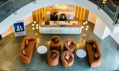an overhead view of a lobby with chairs and a counter at Ascot Hotel Calicut in Calicut