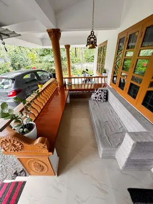a house with a car parked on a porch at Nirvana Stays Banasura, Wayanad in Wayanad
