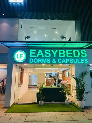 a store front with a sign that reads eggs drums and carpets at LF Easybeds in Kozhikode