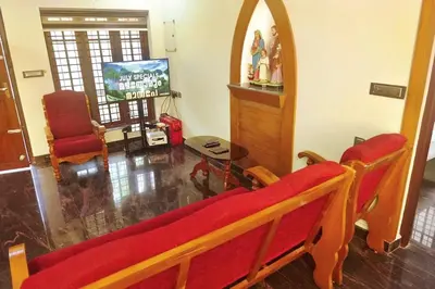 a living room with a couch and a tv at Niki Haven in Kāladi