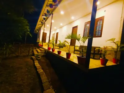 a row of potted plants on the side of a building at Chembani Holidays and Resorts Kanthalloor in Kanthalloor