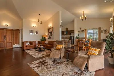a living room with a couch and a table at EKOSTAY - Skyfall Dew Drops in Ooty