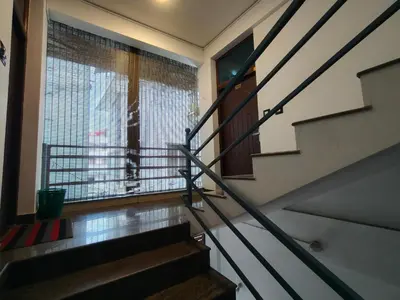 a staircase in a house with a window at Queens INN in Kodungallūr