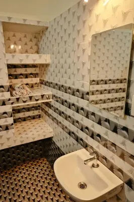 a bathroom with a sink and a mirror at Prithvi Nila Heavens 3 BHK Homestay Ground Floor in Guruvāyūr