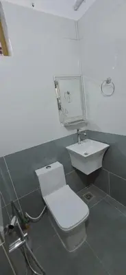 a bathroom with a toilet and a sink at Alanchery Residency in Cheruthuruthi
