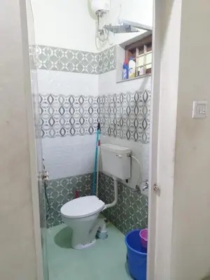 a small bathroom with a toilet in a room at Peaceful Vacation Home Near the City in Cochin