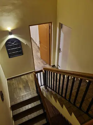 an empty hallway with a staircase and a door at The Ark Haven Ooty by Scenic Serenity Stays in Ketti