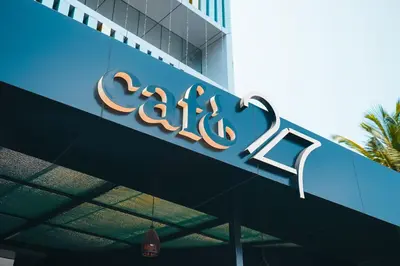 a sign on the side of a building at Dubai Frame Residency And Hotel in Thottada