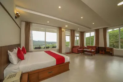 a bedroom with a large bed with red pillows at Heavenly Hills 4 BHK Villa - 1 Bedroom in Kotagiri