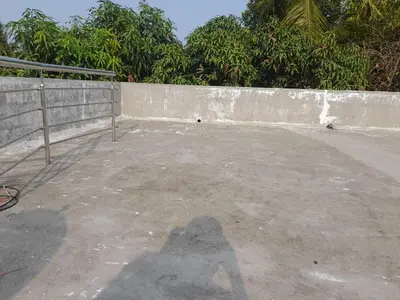 a shadow of a person standing next to a wall at Mannath Home Stay in Alwaye