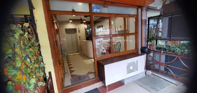 an entrance to a store with glassdoors at Hotel BMR Stay in Pollāchi