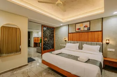 a bedroom with a large bed in a room at Hotel Urban Bella in Kozhikode