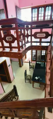 an overhead view of a room with a table and chairs at Banasura Green paradise , Villa , Deluxe rooms , Budget rooms in Padinjarathara