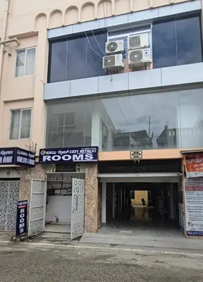 a building with two cameras on top of it at Cozy retreat in Mysore