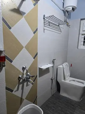 a small bathroom with a toilet and a sink at Nest Resort in Ketti