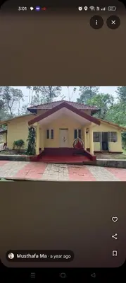 a picture of a small yellow house at Coorg Namana homestay in Suntikoppa