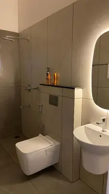 a bathroom with a toilet and a sink at Casa Bella - The Group Stay in Sultan Bathery