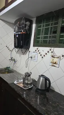 a tea kettle on a counter in a kitchen at Nature View Private Villa in Ooty