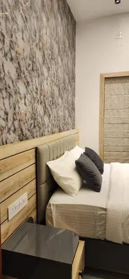 a bedroom with a bed with pillows on it at Itria private pool villa in Pinangode