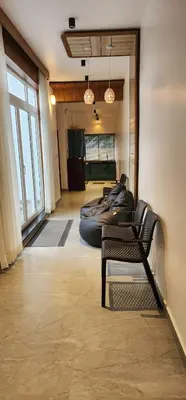 a room with a row of bean bags on the floor at Itria private pool villa in Pinangode