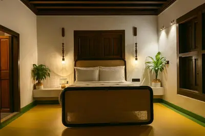 a bedroom with a bed in a room with plants at Seclude Karthika Nivas, Thrissur in Trichūr