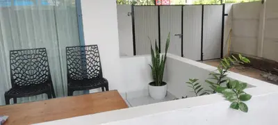 a balcony with two chairs and a table and a mirror at Little home Apartment 1 in Tāzhekkod