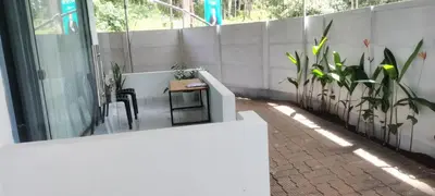 a balcony with a table and chairs and plants at Little home Apartment 1 in Tāzhekkod