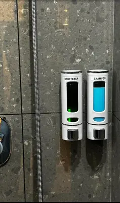 two cell phones are sitting on the ground at Vadanapilly Beach Villa for 8-10 adults in Irimbranallūr