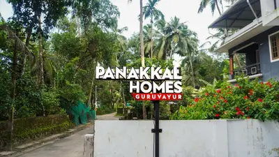 a sign in front of a house at Panakkal Homes in Guruvāyūr