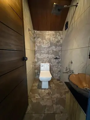 a bathroom with a toilet and a sink at Elim Retreat kanthalloor in Kanthalloor