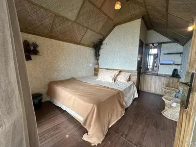 a bedroom with a bed in a small room at Elim Retreat kanthalloor in Kanthalloor