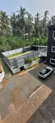 a car parked in a parking lot in front of a building at Anam residence in Tāzhekkod