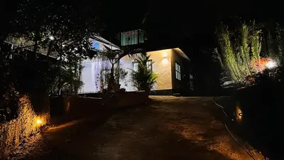 a dark alley with a house at night at Xanadu Inn in Meenangadi