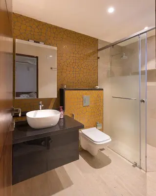 a bathroom with a sink and a toilet and a shower at Zero Degree in Ketti
