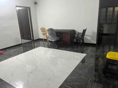 a living room with a table and chairs and a floor at AC 3BHK Full House Kitchen strong WiFi Pollachi in Pollāchi