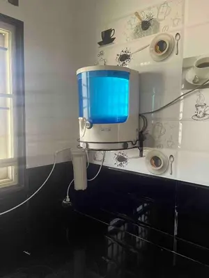 a tv on the wall of a bathroom at AC 3BHK Full House Kitchen strong WiFi Pollachi in Pollāchi