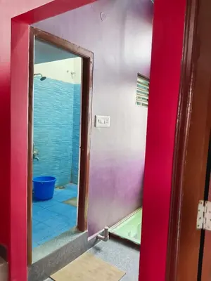 a bathroom with a mirror and a tub in a room at love moon home stay in Mysore