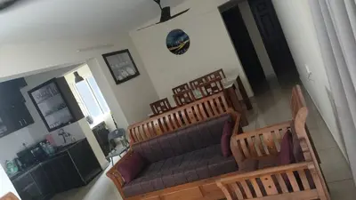 an aerial view of a living room with a couch at City Nature-view apartment in Kozhikode
