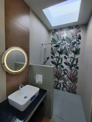 a bathroom with a sink and a mirror at 3BHK - Villa - a greece style - Kayal vizha - near isha yoga - coimbatore in Coimbatore