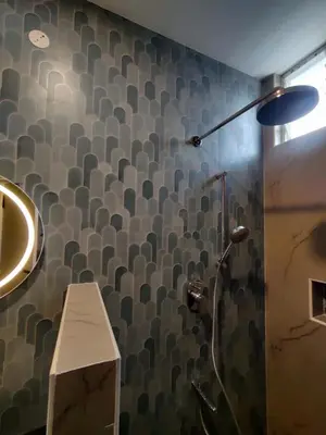 a bathroom with a shower and a wall with a pattern at 3BHK - Villa - a greece style - Kayal vizha - near isha yoga - coimbatore in Coimbatore