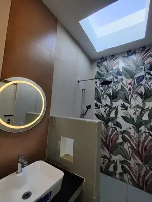 a bathroom with a sink and a mirror at 3BHK - Villa - a greece style - Kayal vizha - near isha yoga - coimbatore in Coimbatore