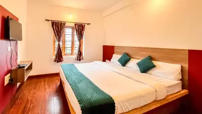 a bedroom with a large bed in a room at Willostays Cluster Clouds in Ooty