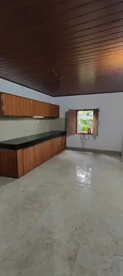 a large empty room with a basketball hoop in it at Traditional Kerala house, Kannur-Thalassery in Tellicherry