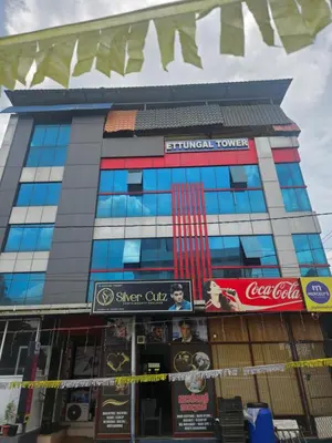 a building with signs on the front of it at grandresidency in Kāladi