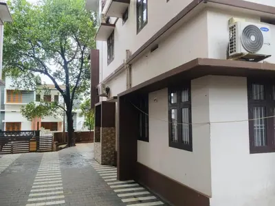 an empty street in front of a building at Havence Villas - Kottakkal in Kottakkal