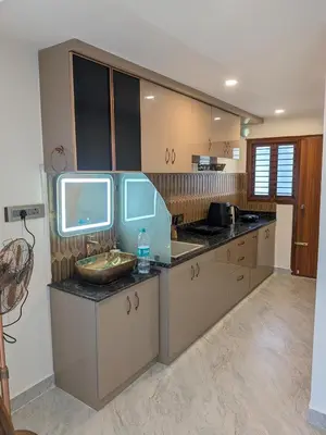 a kitchen with a sink and a counter top at Auric by Hillton in Mysore